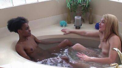 Ebony lesbian and her blonde girlfriend fuck in the tub on lovepornstars.com